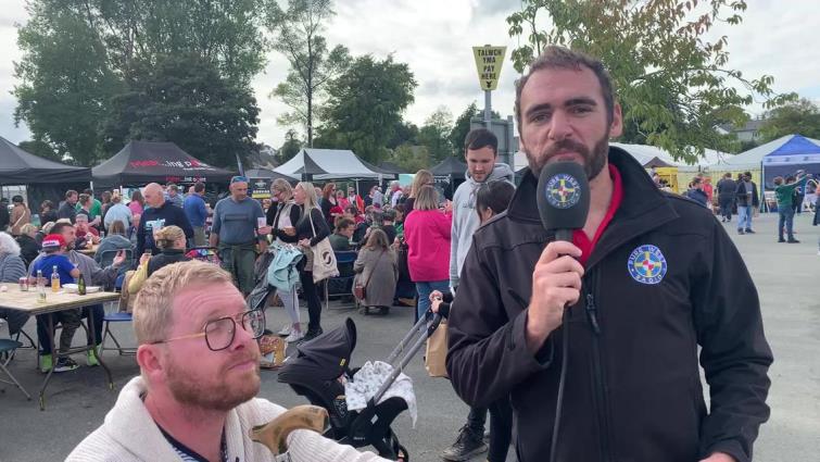 Tom busy interviewing at an event